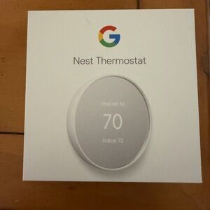 Google Nest Thermostat in White and Gray Box Accent